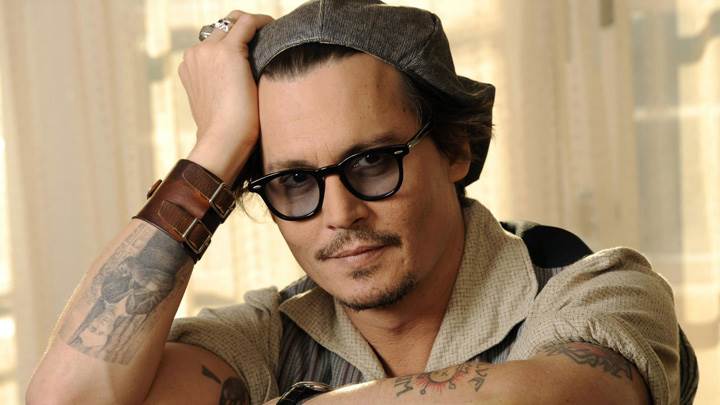 Johnny Depp Looking Smart Sitting Pose